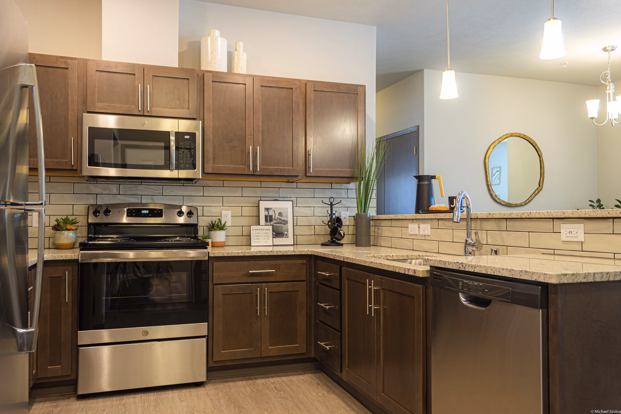 Modern kitchen with stainless steel appliances at Broadway190 Apartments, a Greystar luxury community