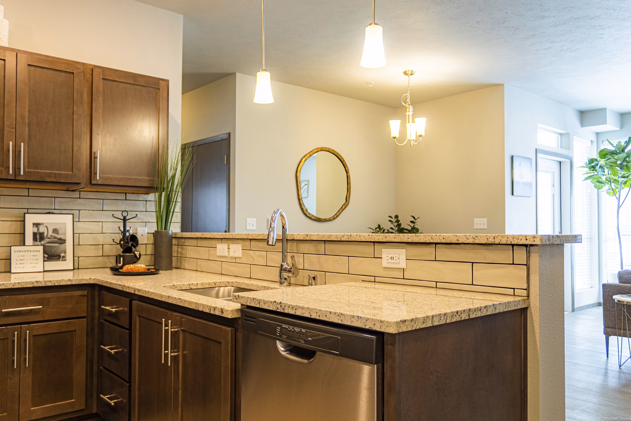 Modern kitchen with stainless steel appliances at Broadway190 Apartments, luxury living in vibrant city setting