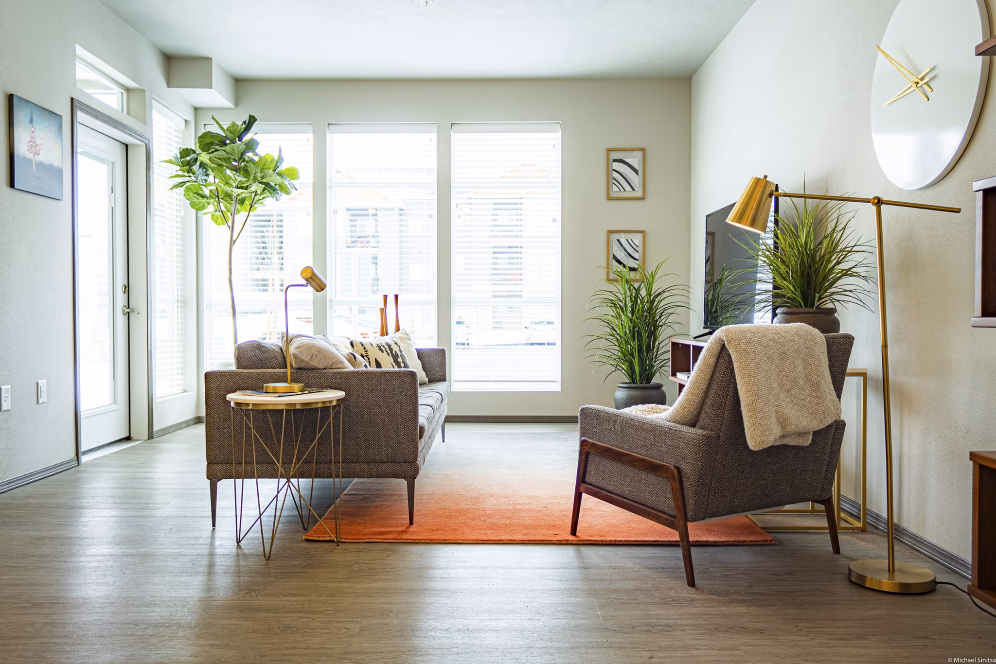 Bright living room with contemporary decor at Broadway190 Apartments