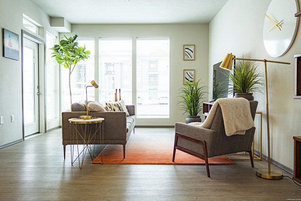 Bright living room with contemporary decor at Broadway190 Apartments