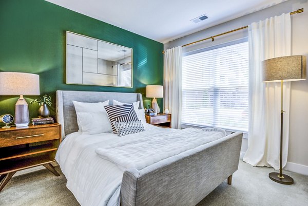 Cozy bedroom with elegant decor at The Jameson at Kincora Apartments