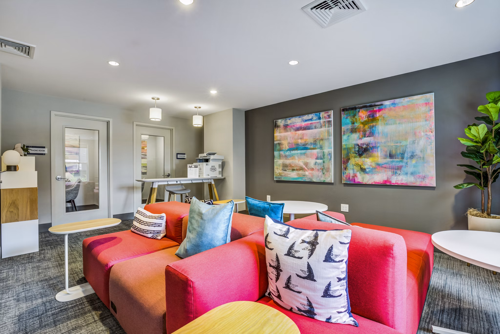 Clubhouse lobby featuring modern seating and elegant lighting at The Jameson at Kincora Apartments