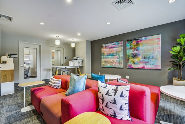 Clubhouse lobby featuring modern seating and elegant lighting at The Jameson at Kincora Apartments
