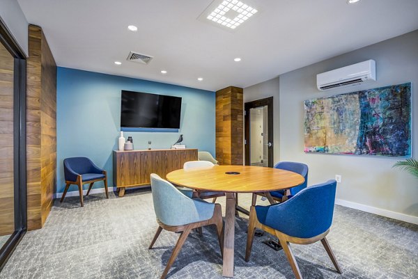 Clubhouse lounge featuring modern decor and communal seating at The Jameson at Kincora Apartments