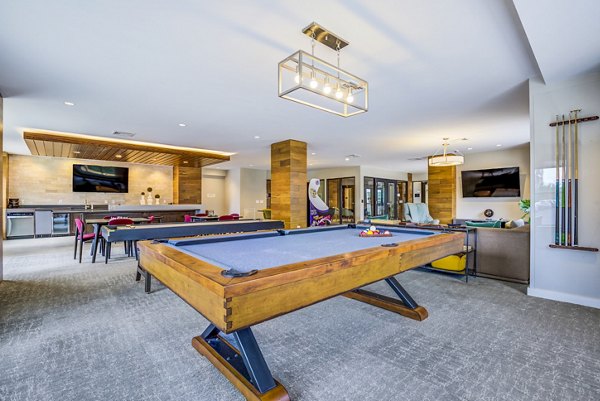 Clubhouse/lobby featuring modern decor and seating at The Jameson at Kincora Apartments
