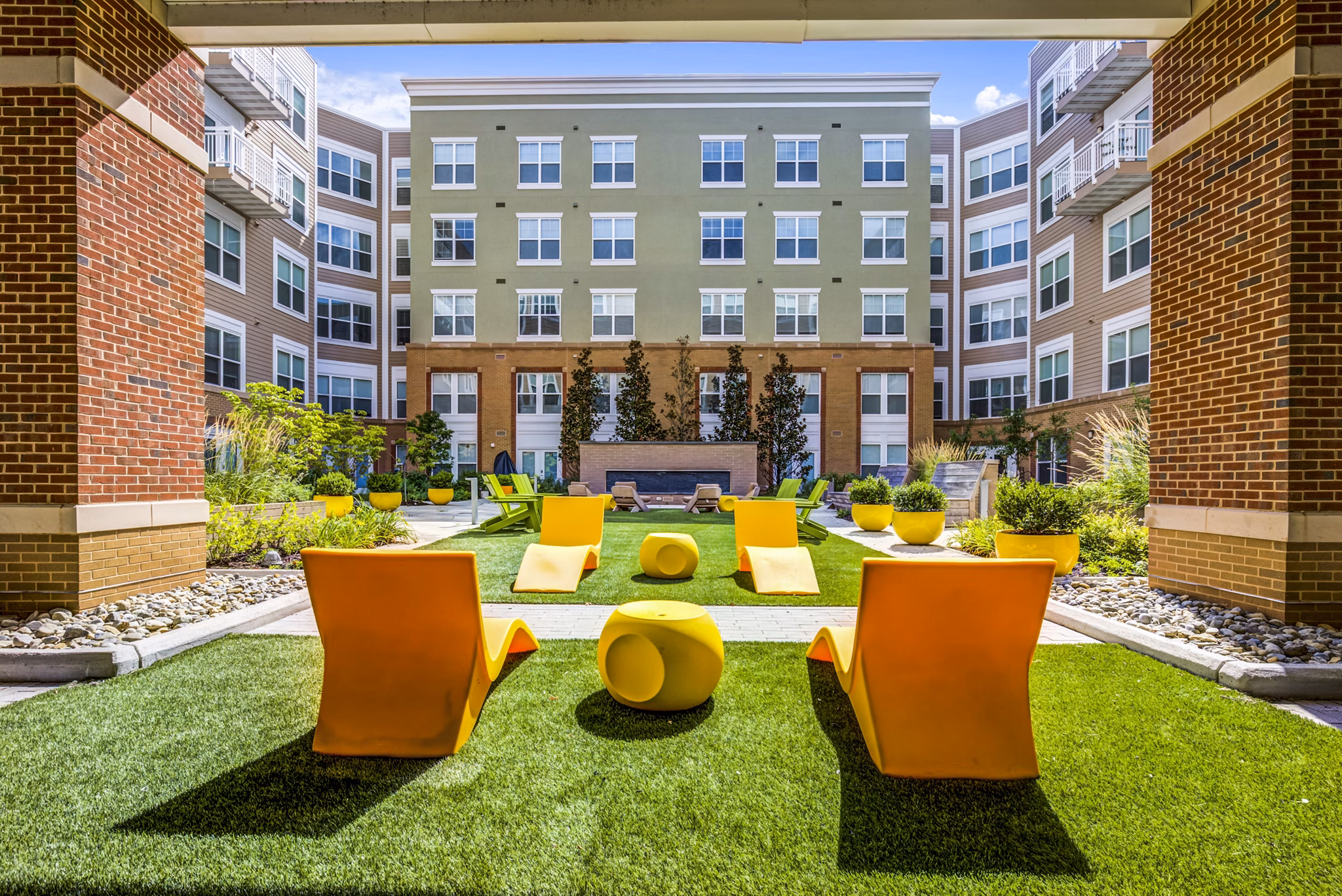 Spacious patio with stylish outdoor furniture at The Jameson at Kincora Apartments, perfect for relaxation and social gatherings