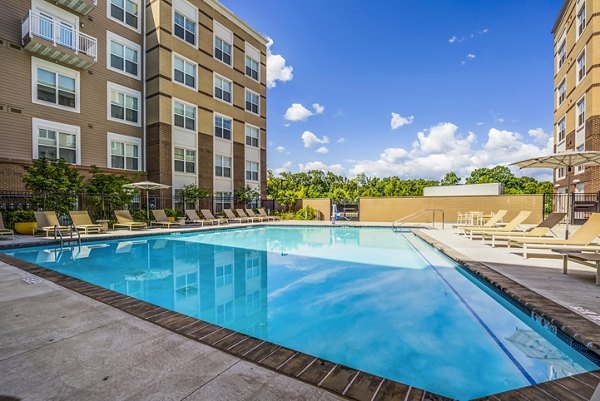Rooftop pool with lounge chairs at The Jameson at Kincora Apartments