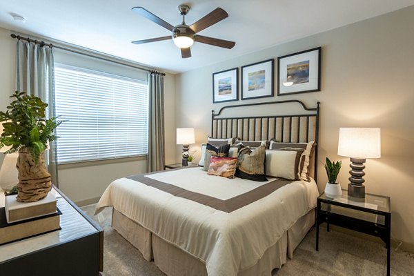 Cozy bedroom with modern decor at Domain Morgans Landing Apartments