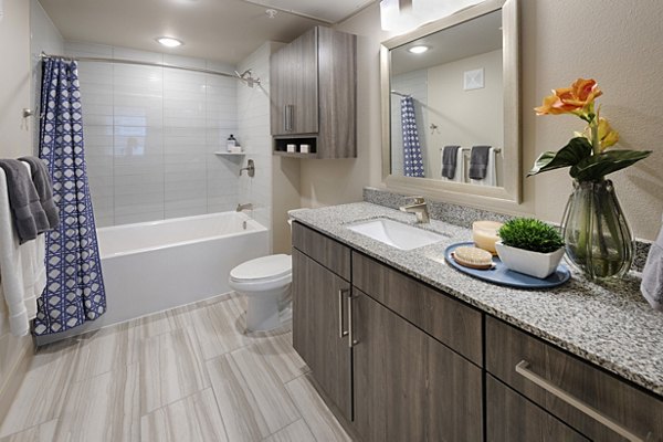 Bathroom with sleek fixtures and double vanity in Domain Morgans Landing Apartments