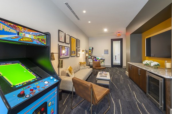 Game room with pool table and modern seating at Domain Morgans Landing Apartments