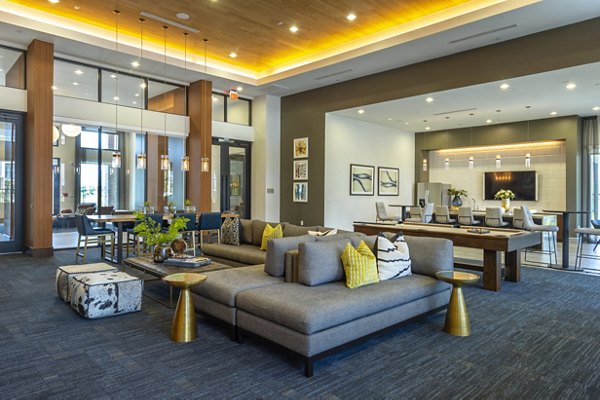 Clubhouse with modern design and lounge seating at Domain Morgans Landing Apartments