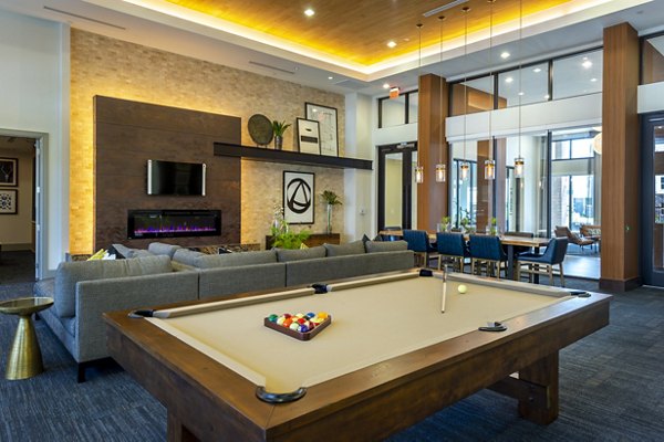 Game room featuring pool tables and arcade games at Domain Morgans Landing Apartments Perfect space for relaxation and entertainment