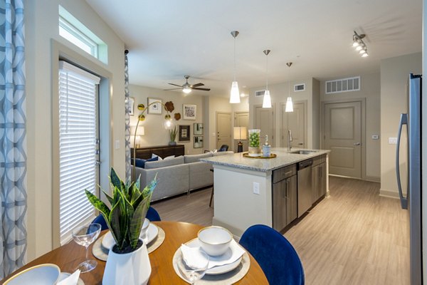 Dining area featuring elegant decor and modern seating at Domain Morgans Landing Apartments Perfect for hosting gatherings in style