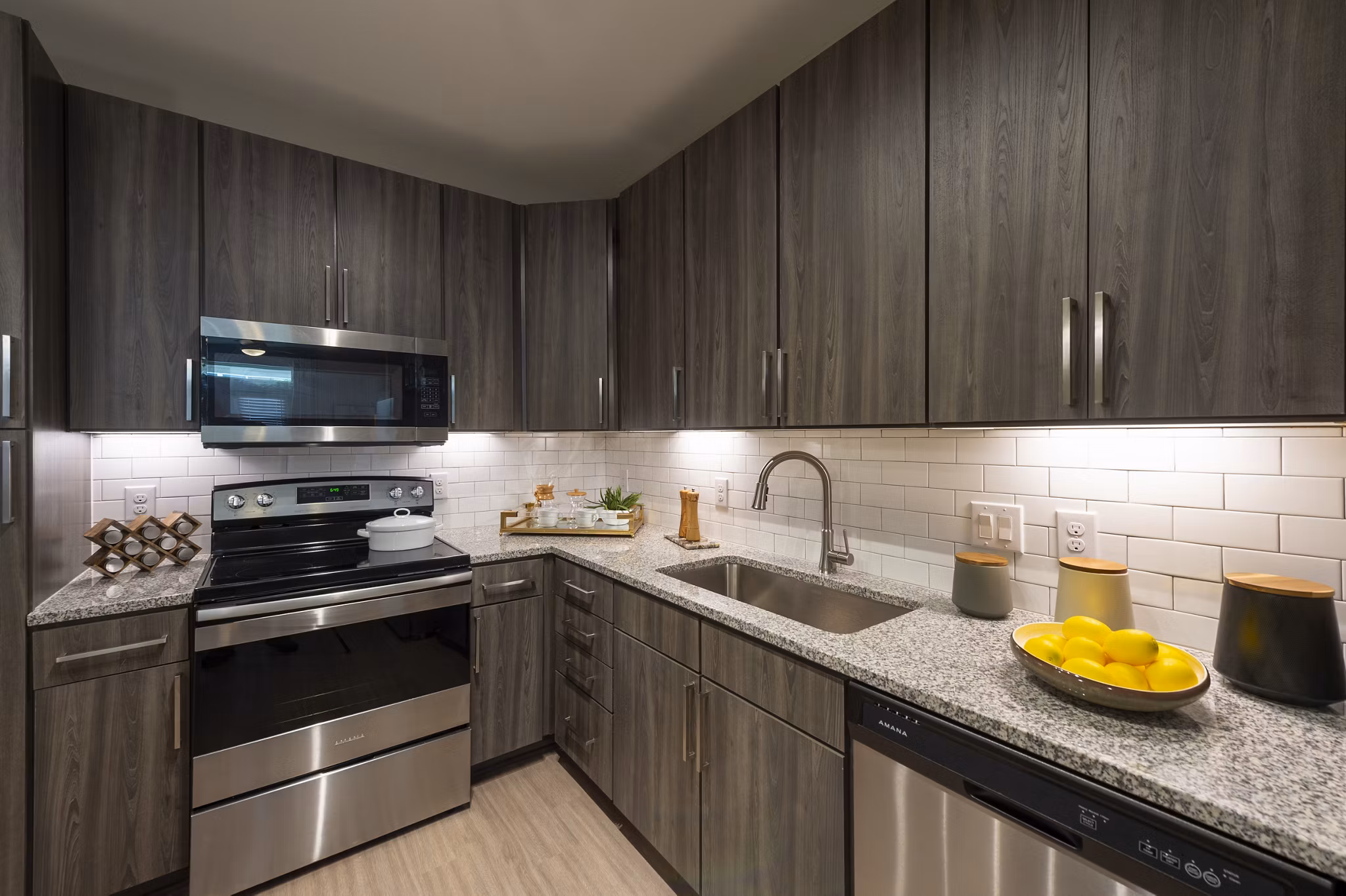 Modern kitchen with stainless steel appliances at Domain Morgans Landing Apartments