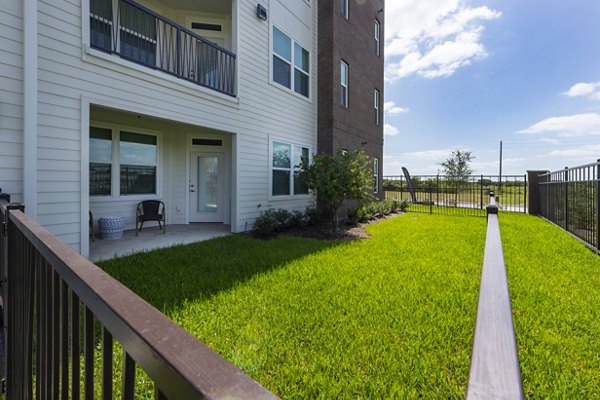 Spacious outdoor patio with modern seating at Domain Morgans Landing Apartments, ideal for relaxation and social gatherings