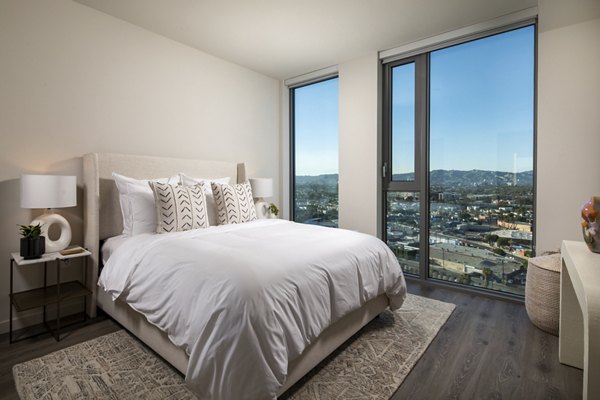 Luxurious bedroom with elegant decor at ARQ Apartments, offering comfortable living in a stylish setting