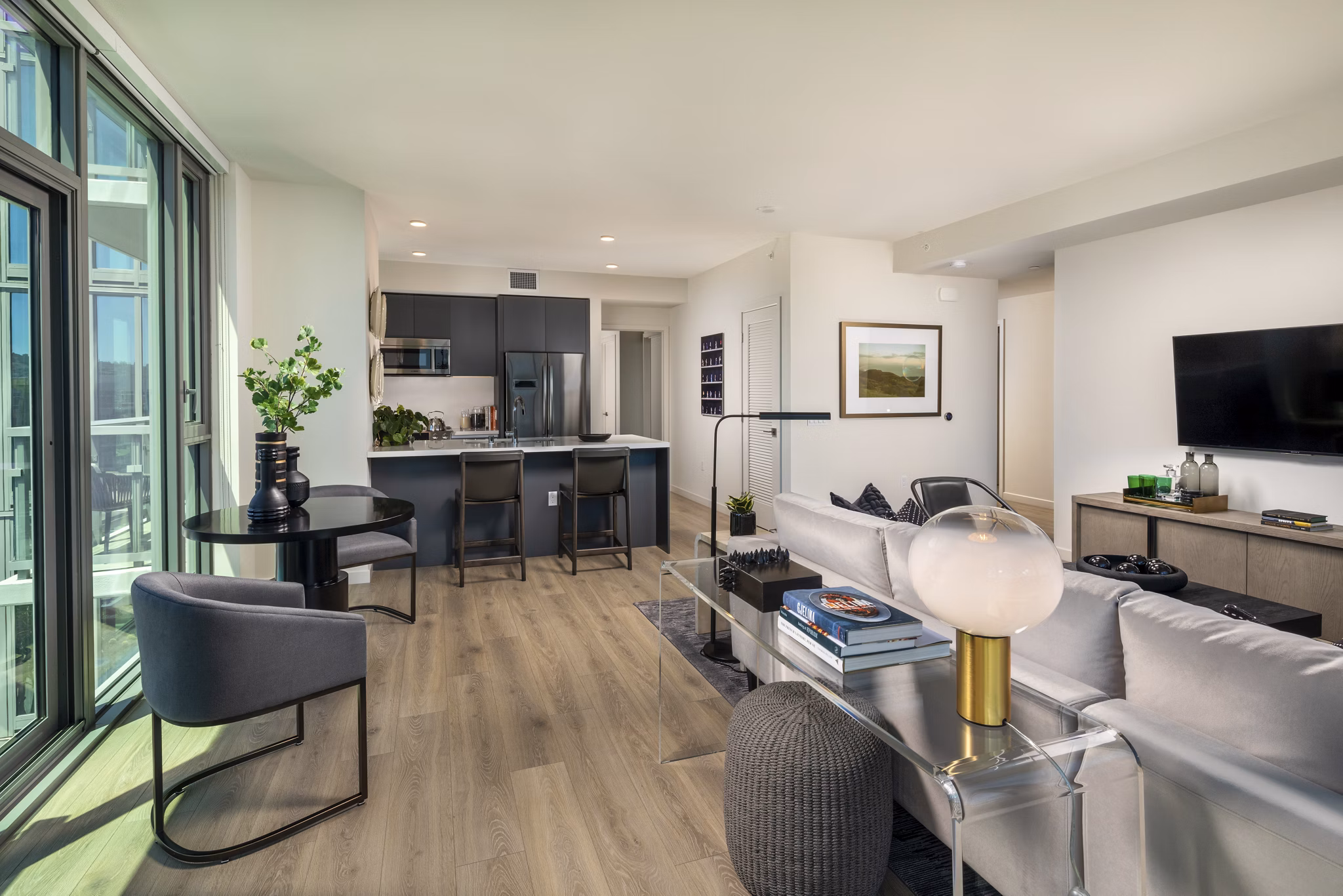 Elegant kitchen with modern appliances and quartz countertops in ARQ Apartments