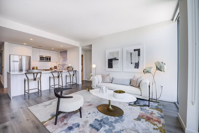 Luxe living room with hardwood floors and modern decor in ARQ Apartments, offering comfort and style for residents in Los Angeles, CA.