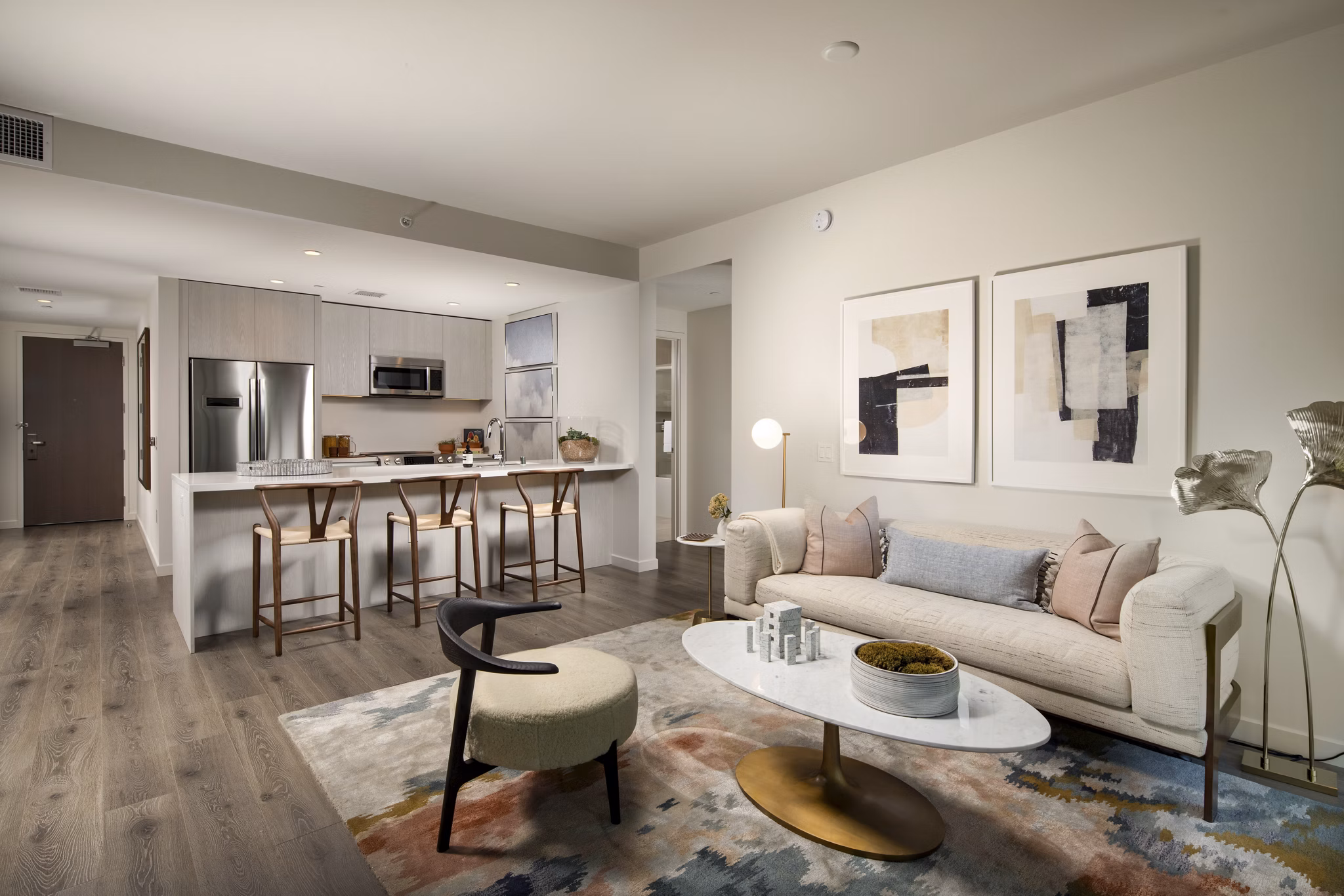 Luxe living room with hardwood floors and modern decor in ARQ Apartments, offering comfort and style for residents in Los Angeles, CA.