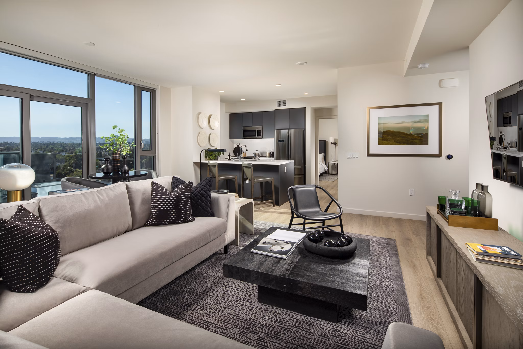 Spacious living room with chic dÃ©cor and natural light at ARQ Apartments, offering a luxurious lifestyle