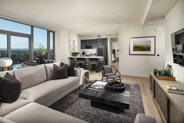 Spacious living room with chic dÃ©cor and natural light at ARQ Apartments, offering a luxurious lifestyle