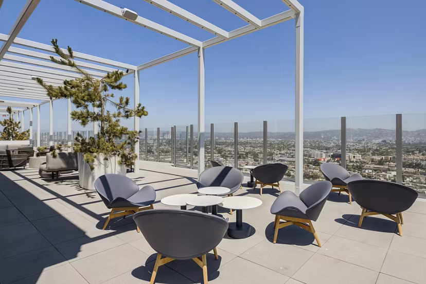 Stylish patio with modern seating at ARQ Apartments, perfect for outdoor relaxation in a luxury setting
