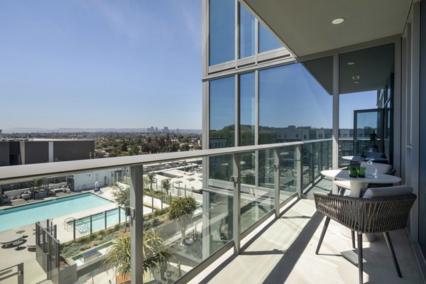 Stylish patio with modern seating at ARQ Apartments, perfect for outdoor relaxation in a luxury setting