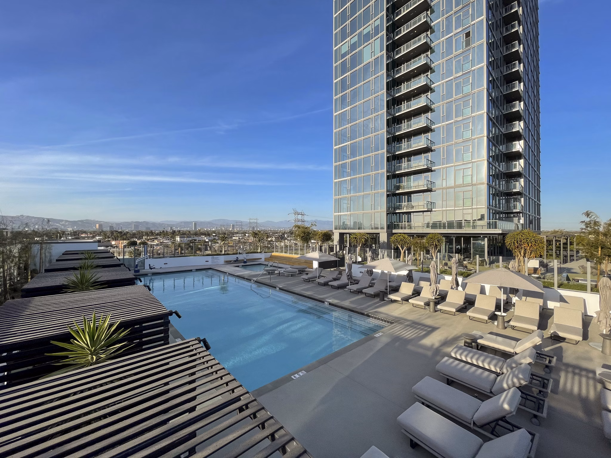 Luxurious poolside with cabanas at ARQ Apartments