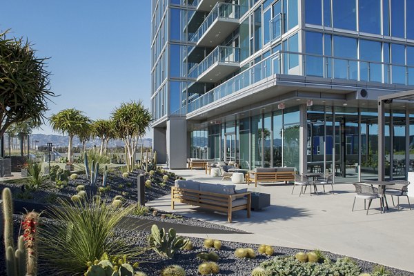 Serene courtyard with lush greenery at ARQ Apartments, a Greystar luxury apartment community