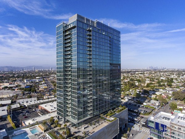 Panoramic city view from a spacious balcony at ARQ Apartments