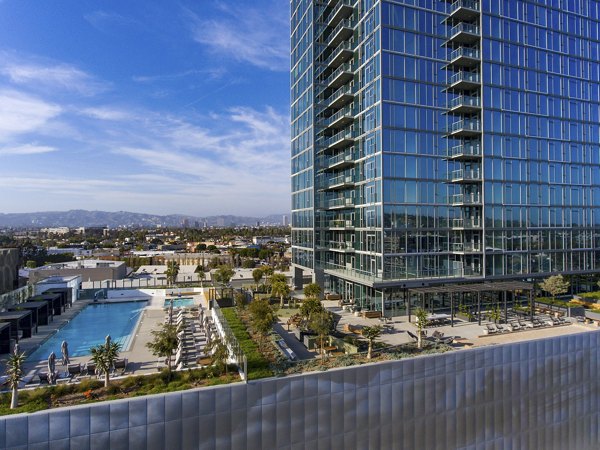 Cityscape view from a balcony at ARQ Apartments showcasing luxury living in a vibrant urban setting