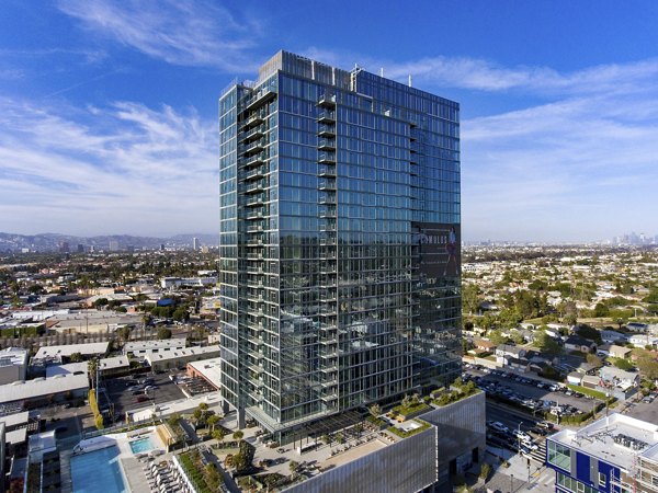 City skyline view from a luxurious high-rise balcony at ARQ Apartments