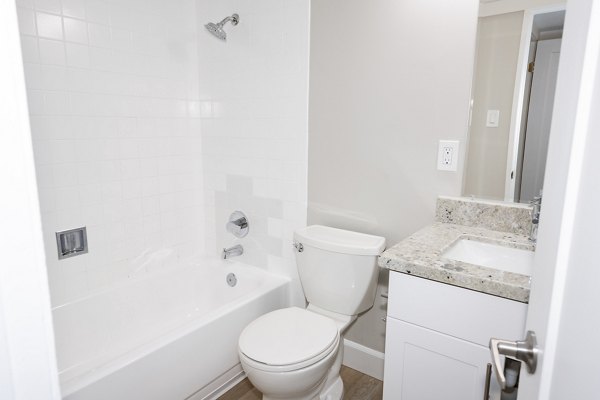 Bathroom with elegant fixtures in Oak & Iron luxury apartments