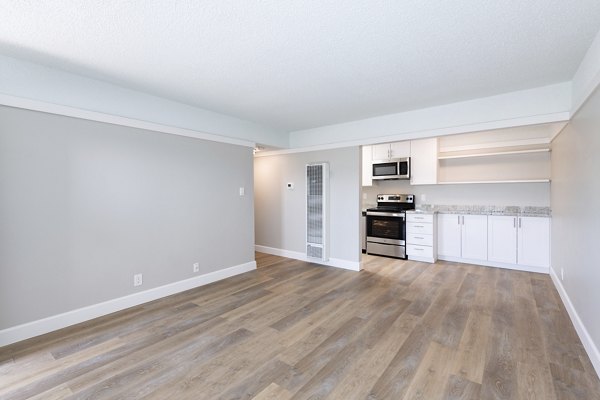 Elegant dining area with designer lighting in Oak & Iron luxury apartments