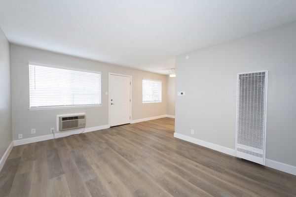 Modern kitchen with stainless steel appliances in Oak & Iron luxury apartments