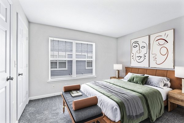Cozy bedroom with modern furnishings at Banyan Grove Apartments, offering luxury living and comfort