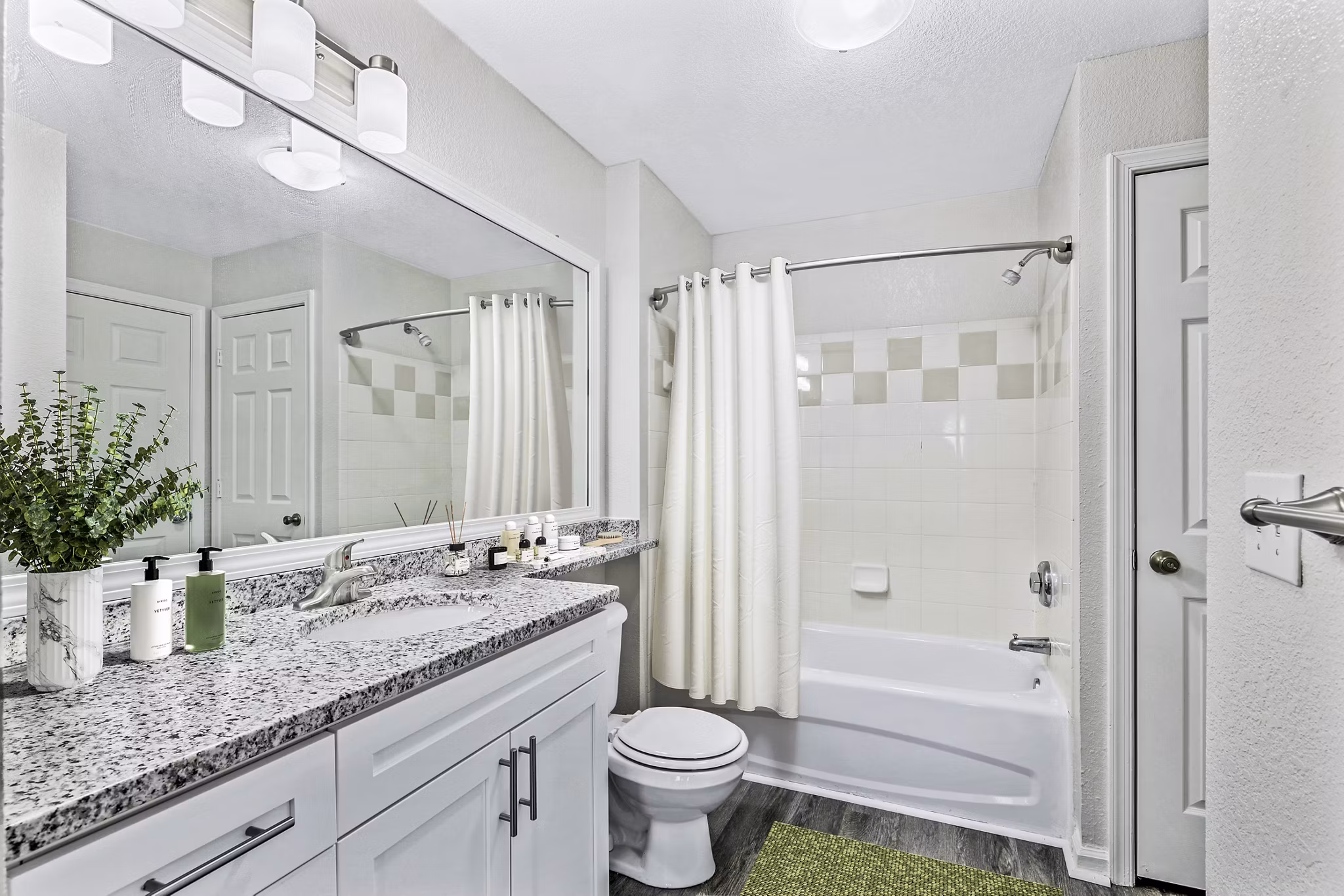 Modern bathroom with sleek fixtures at Banyan Grove Apartments featuring luxury details