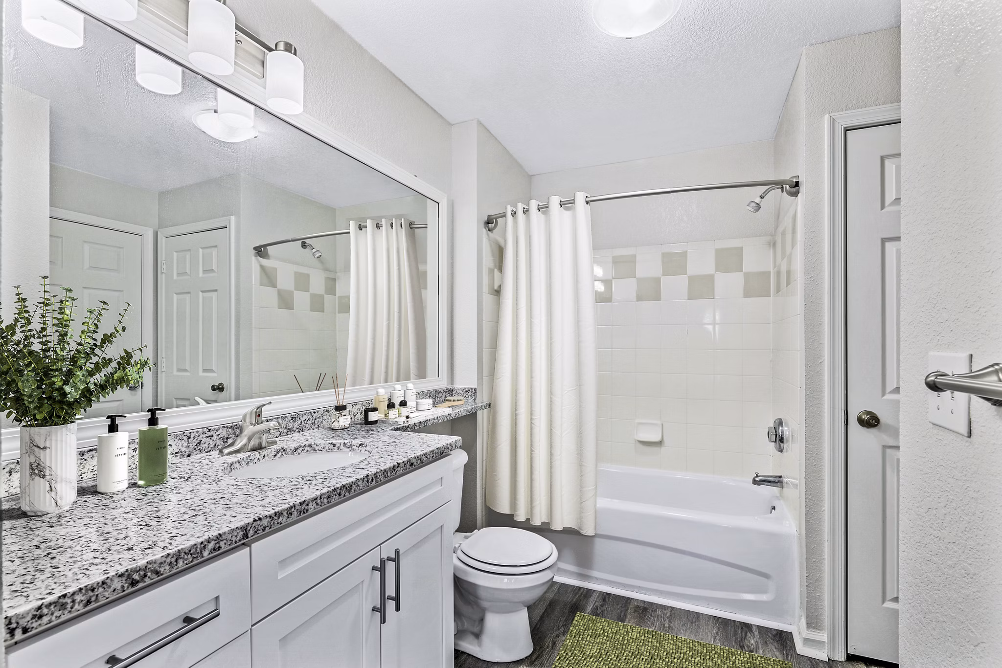 Modern bathroom with sleek fixtures at Banyan Grove Apartments featuring luxury details
