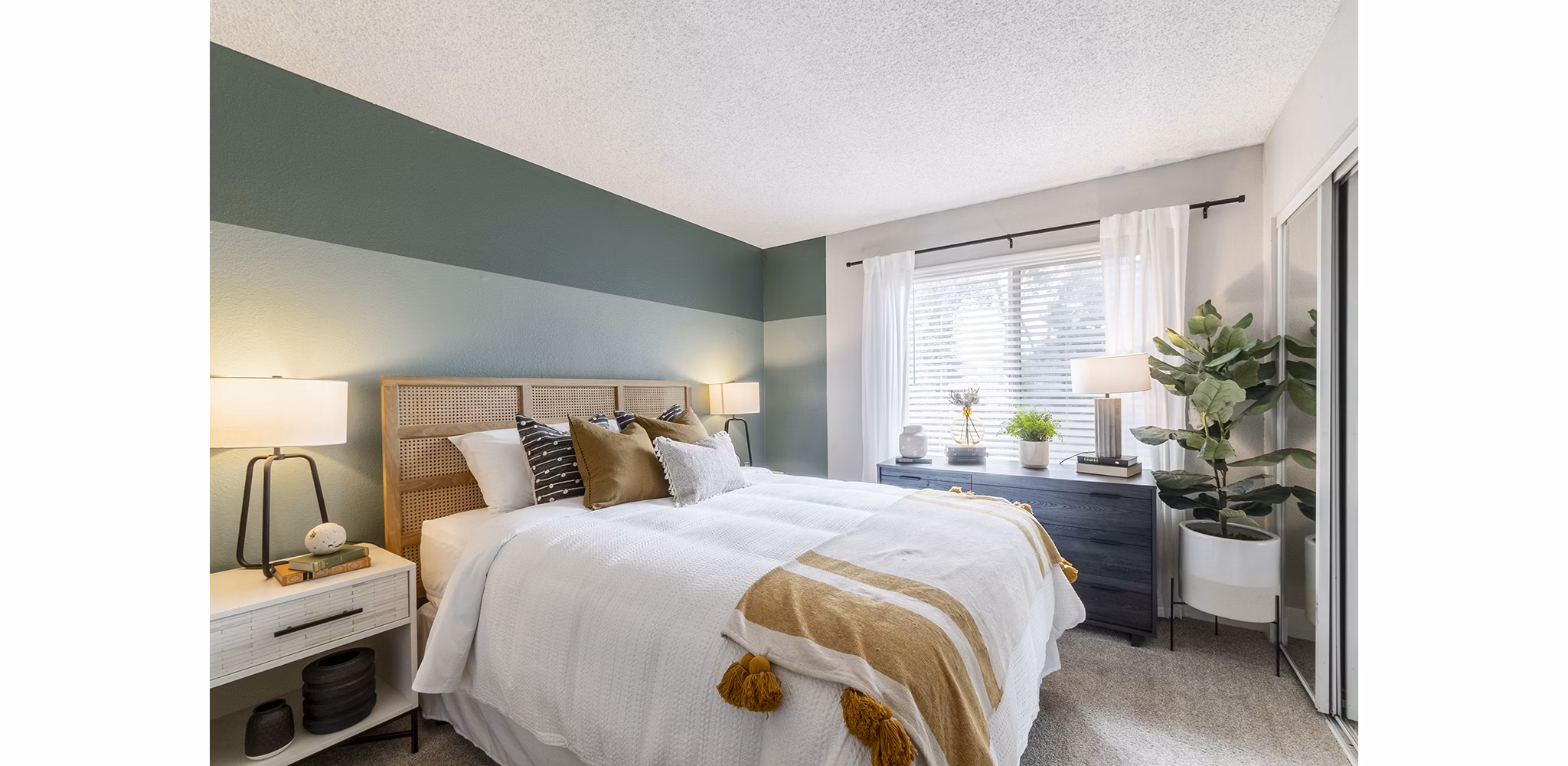 bedroom at The Luxe Apartments