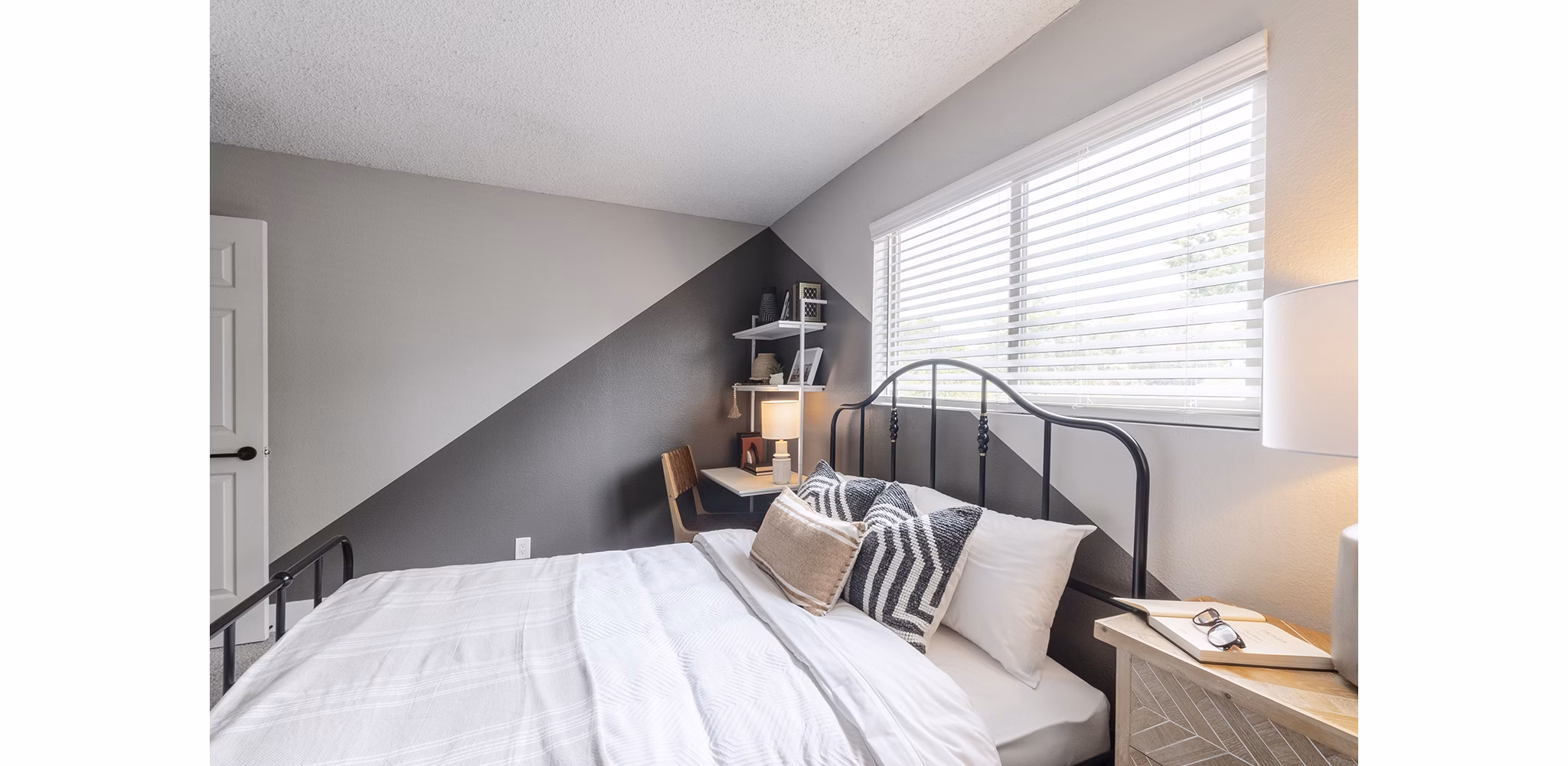 bedroom at The Luxe Apartments