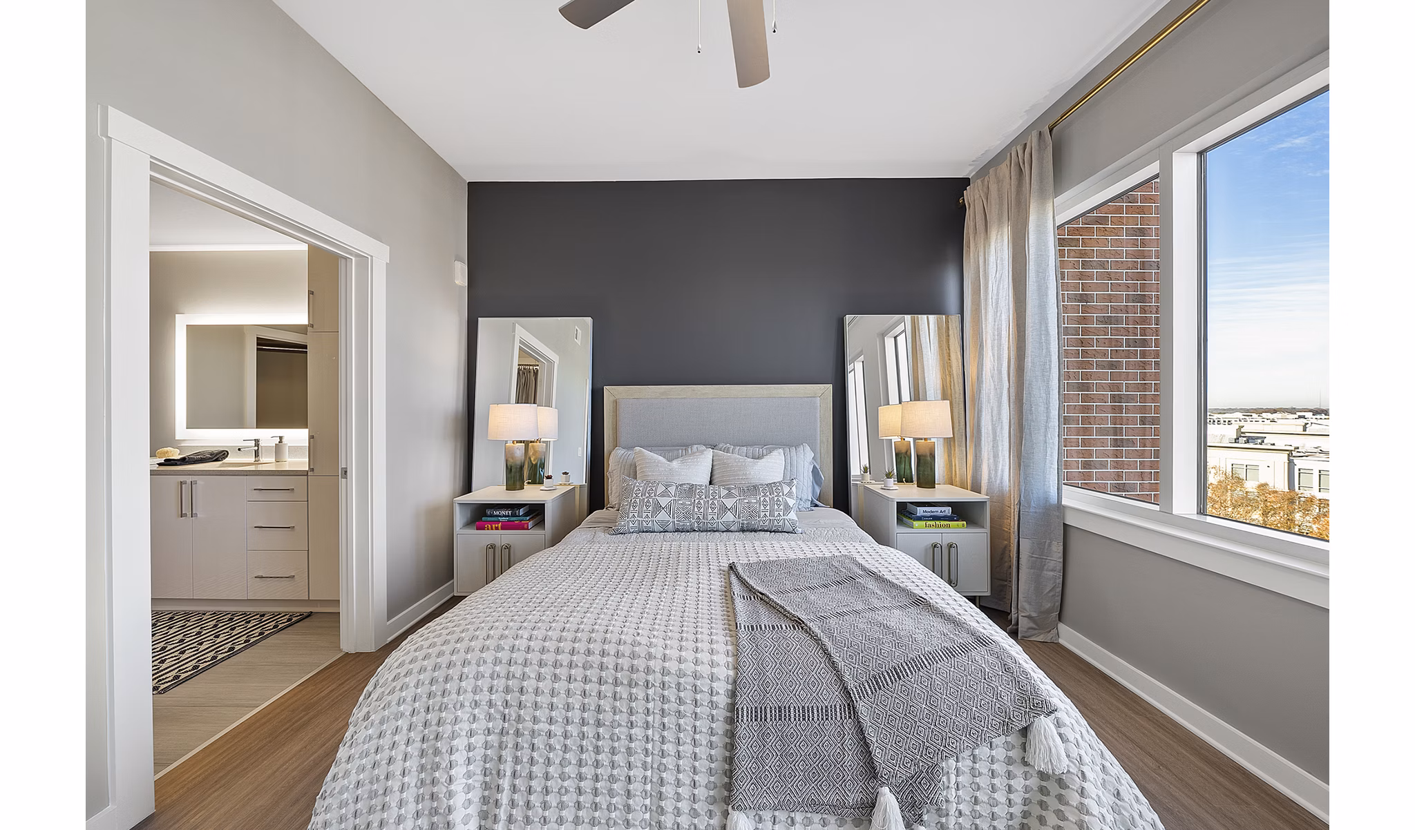 Cozy bedroom with modern furnishings at Element SouthPark Apartments in Charlotte