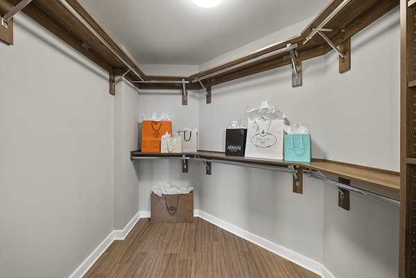 Spacious bedroom closet with custom shelving in Element SouthPark Apartments, featuring ample storage space for luxury living