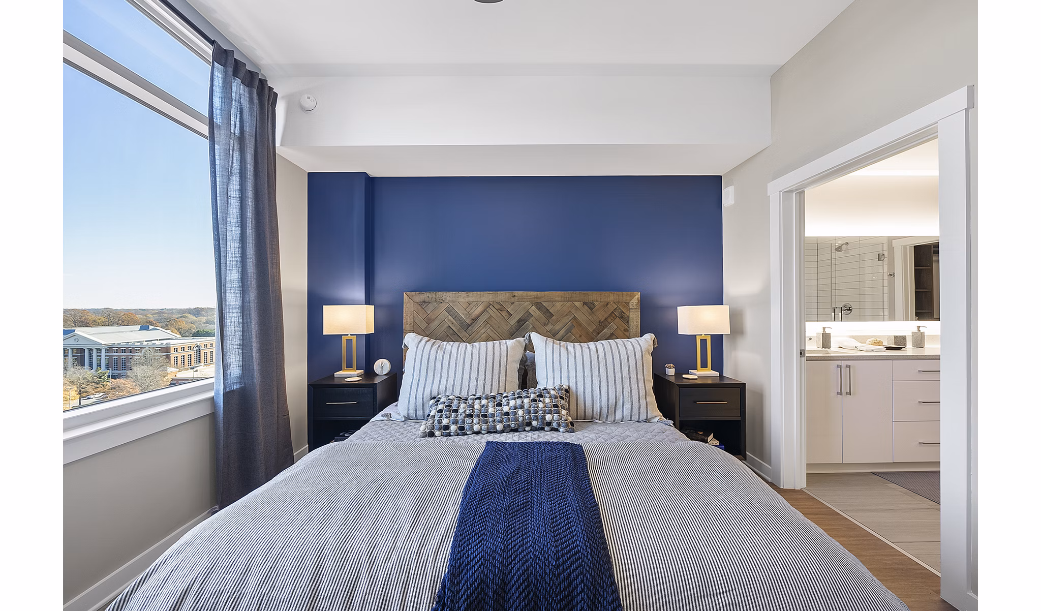 Cozy bedroom with modern decor at Element SouthPark Apartments featuring luxury living amenities