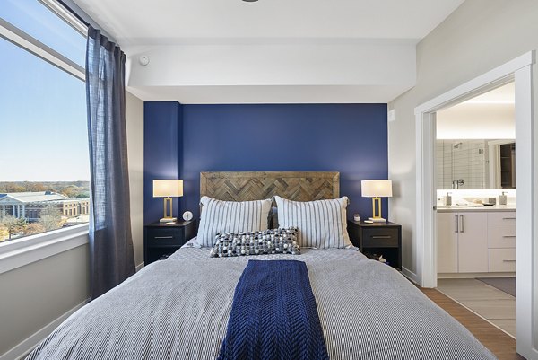 Cozy bedroom with modern decor at Element SouthPark Apartments featuring luxury living amenities