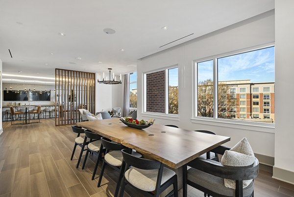 Spacious clubhouse with stylish seating and vibrant decor at Element SouthPark Apartments, ideal for luxury gatherings and events