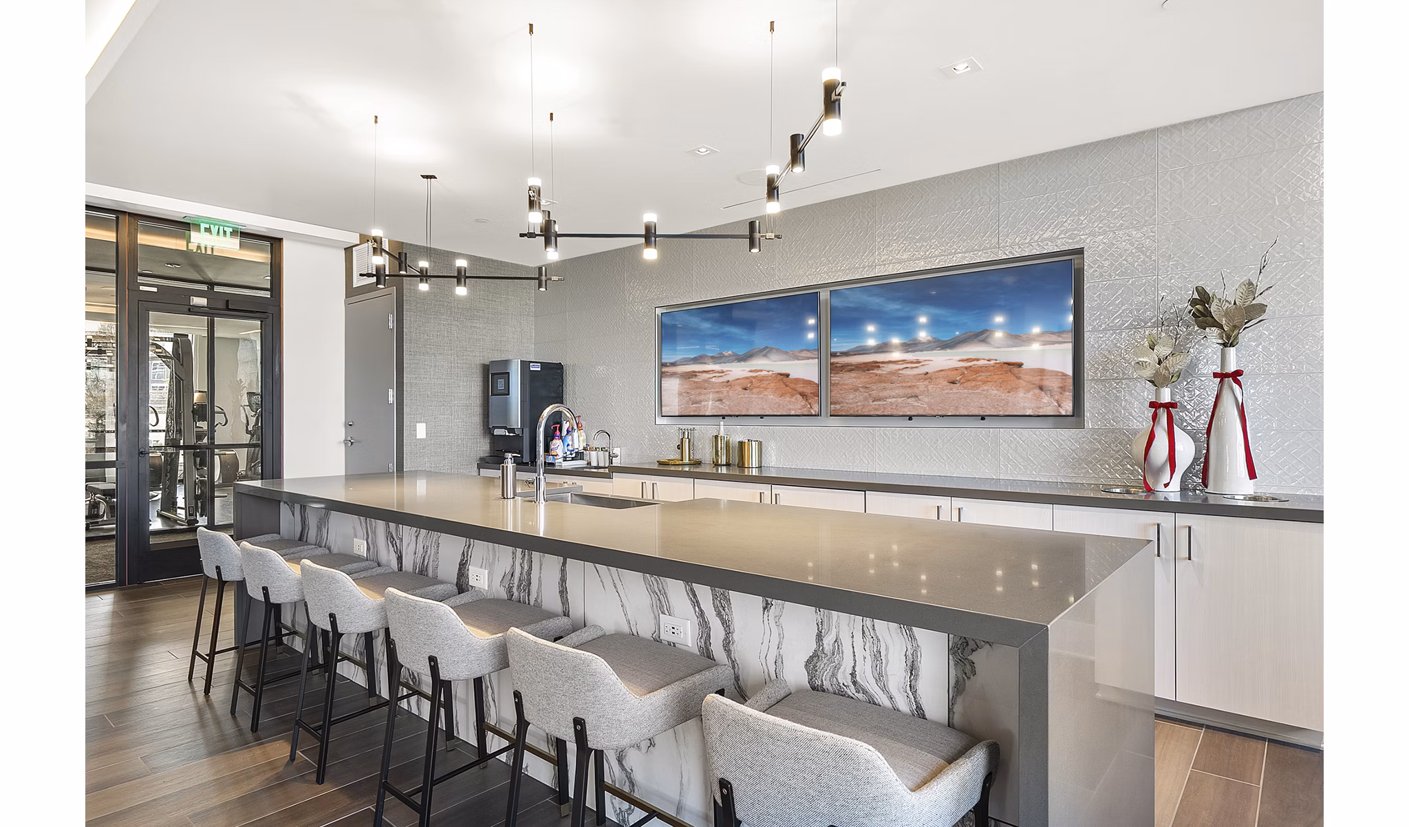 Clubhouse featuring modern design and ample seating at Element SouthPark Apartments
