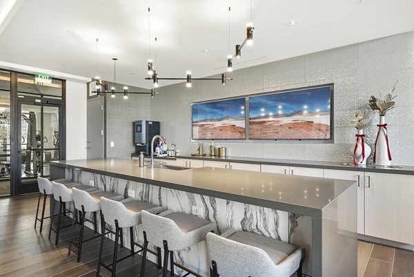 Clubhouse featuring modern design and ample seating at Element SouthPark Apartments