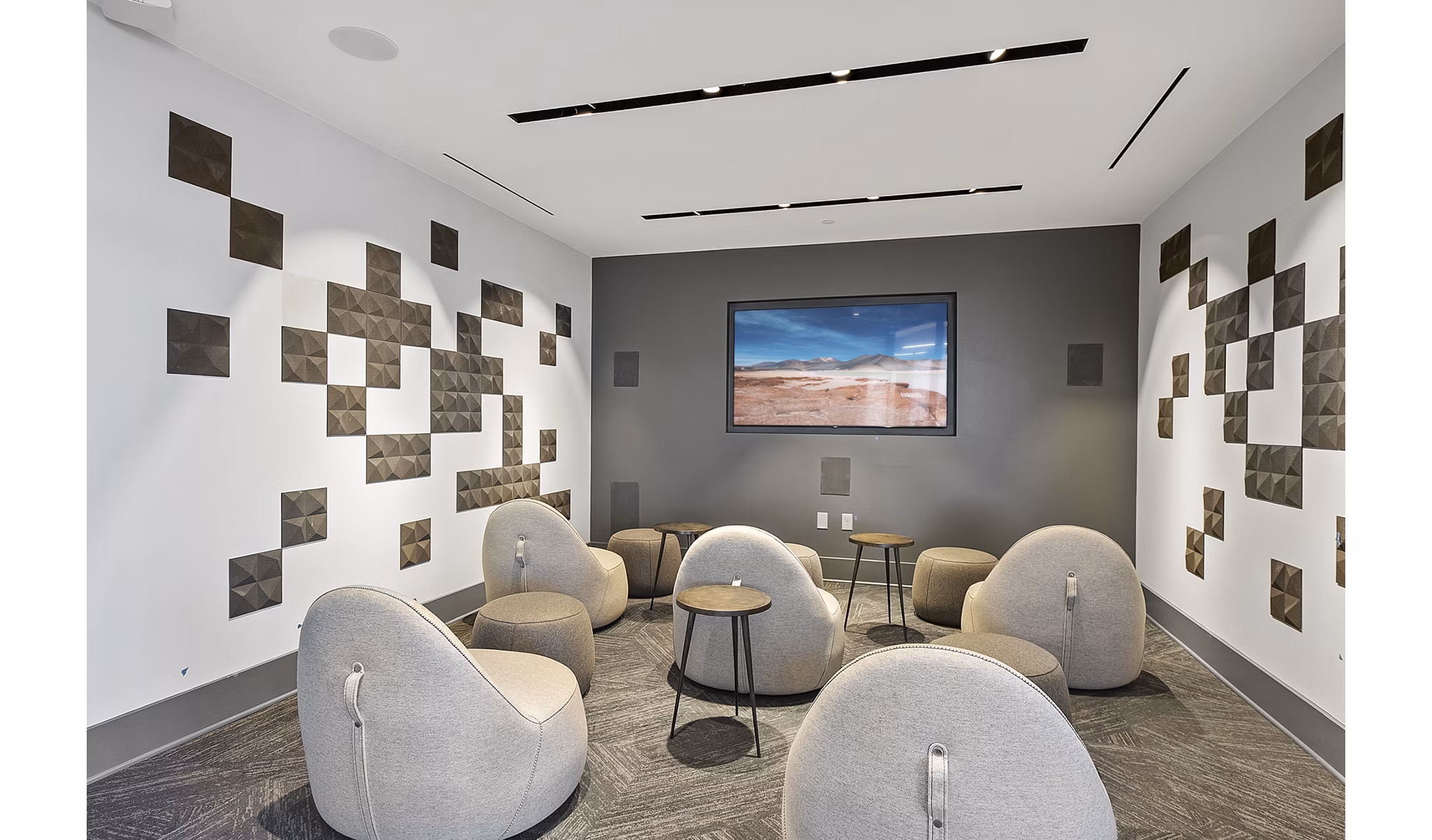 Modern clubhouse theater with plush seating at Element SouthPark Apartments offering luxury entertainment for residents