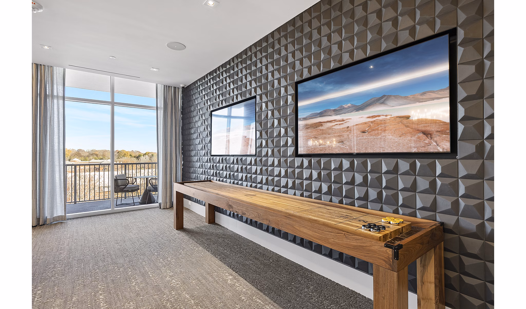 Game room with billiards table and lounge seating at Element SouthPark Apartments