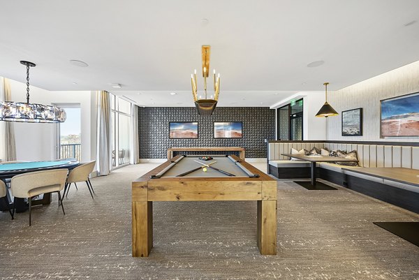 Game room featuring pool table and modern seating at Element SouthPark Apartments